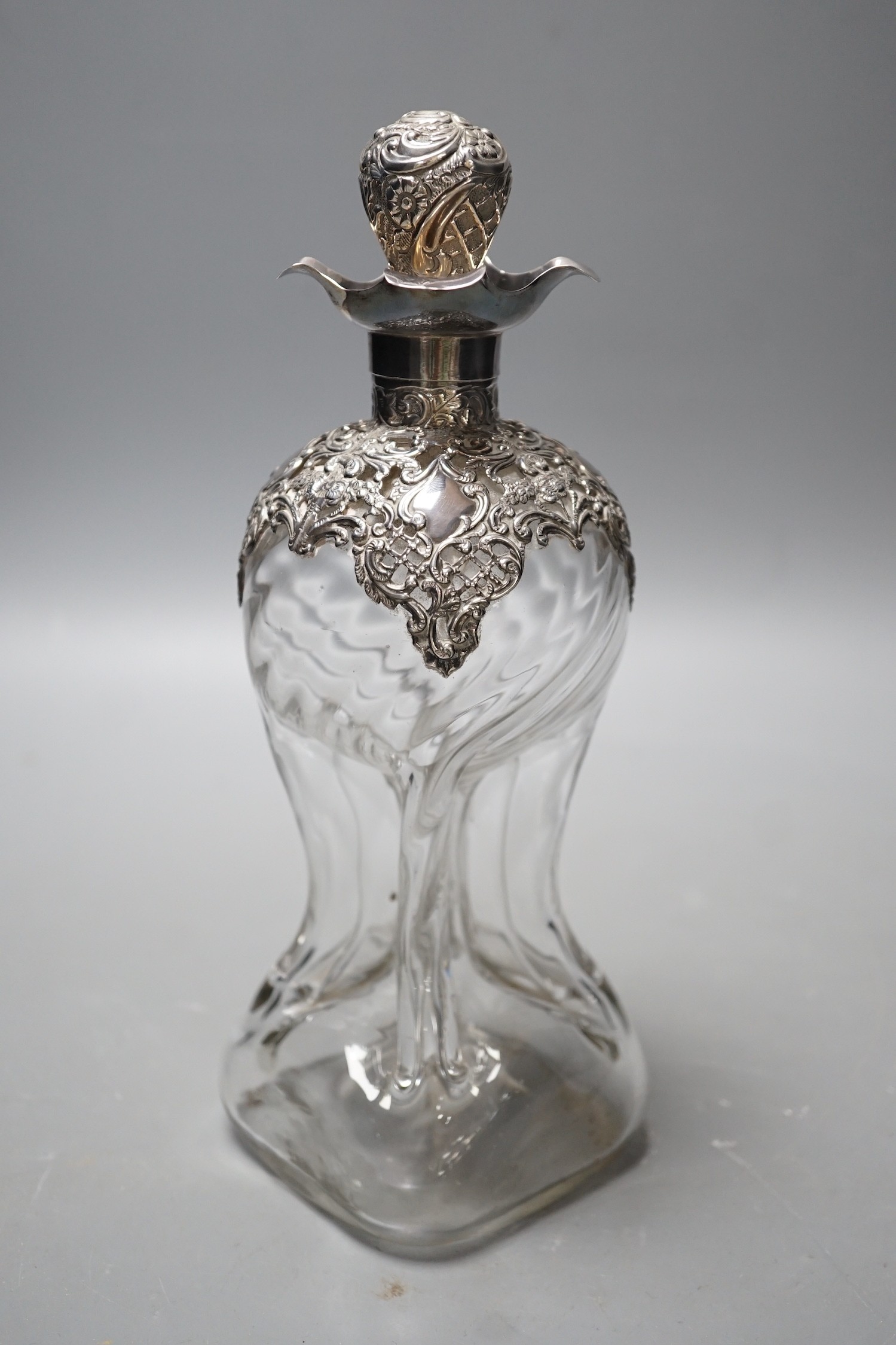 A late Victorian silver mounted waisted glass decanter and stopper, Henry Matthews, Birmingham, 1899, height 24cm.